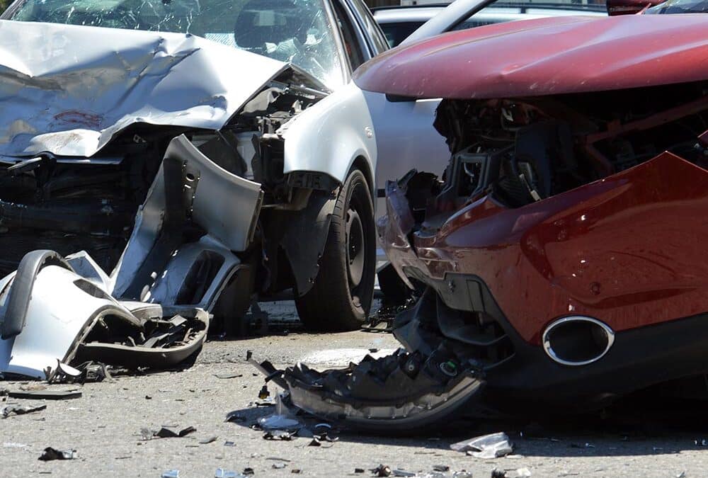 Two cars damaged in a collision.