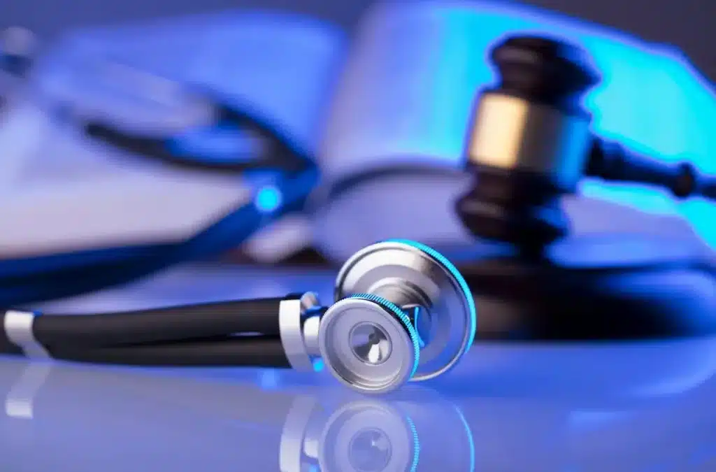 Gavel and stethoscope on a book.